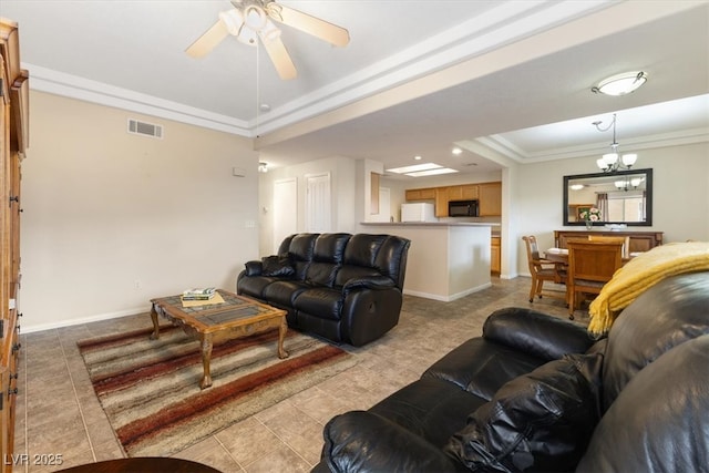 living room featuring baseboards, ceiling fan with notable chandelier, visible vents, and ornamental molding