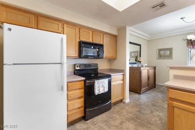 kitchen featuring light countertops, visible vents, black appliances, and light brown cabinetry