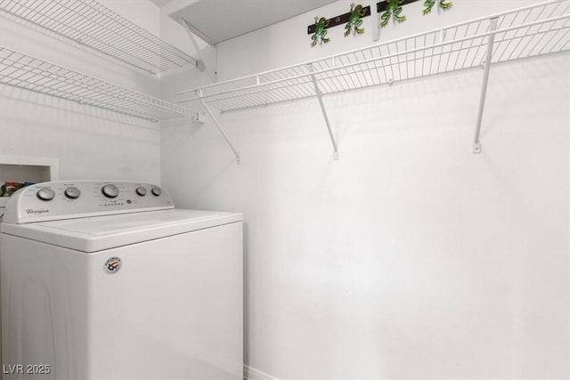 laundry area featuring washer / dryer and laundry area