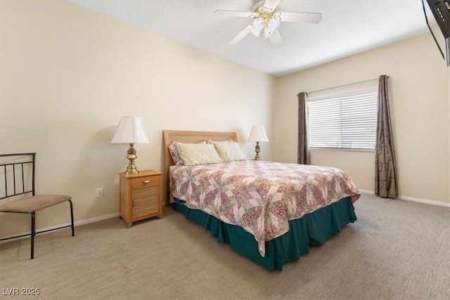 carpeted bedroom featuring baseboards and a ceiling fan