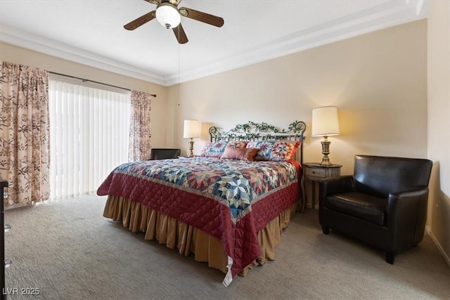 carpeted bedroom featuring ornamental molding and ceiling fan