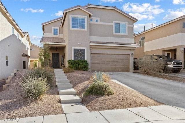 traditional-style house with concrete driveway, an attached garage, and stucco siding