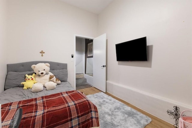 bedroom with wood finished floors