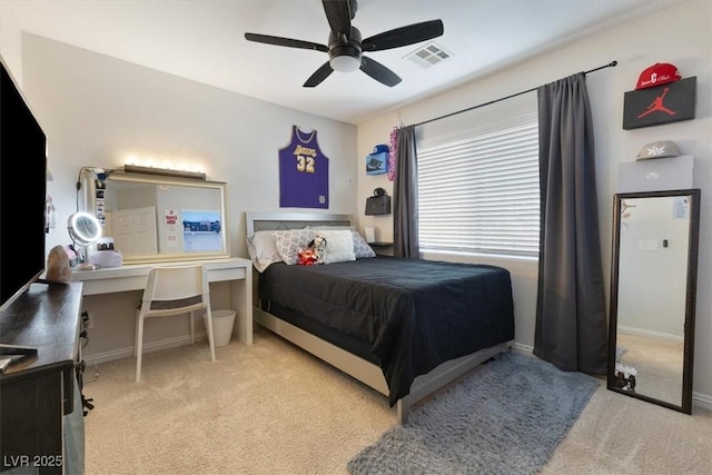 carpeted bedroom featuring visible vents, ceiling fan, and baseboards