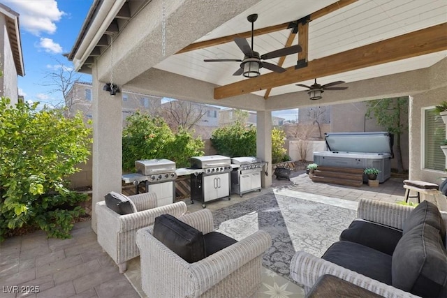 view of patio / terrace featuring a hot tub, fence, grilling area, and a ceiling fan