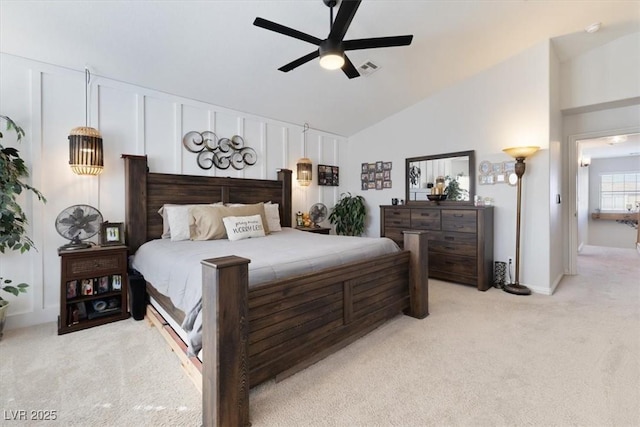 bedroom with light carpet, visible vents, a ceiling fan, and lofted ceiling