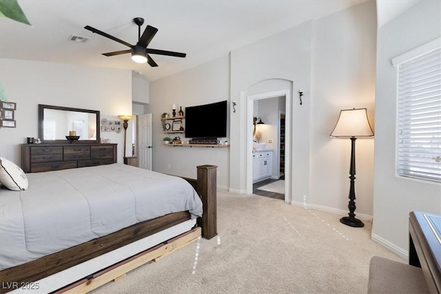 bedroom with lofted ceiling, carpet floors, visible vents, and baseboards