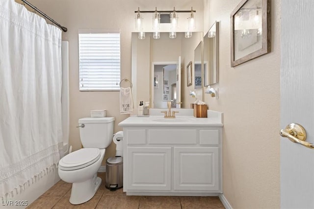 bathroom with baseboards, a shower with shower curtain, toilet, tile patterned flooring, and vanity