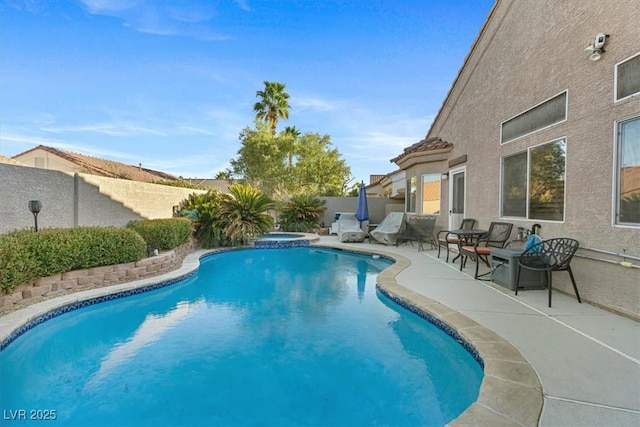 view of swimming pool featuring a fenced backyard, a fenced in pool, and a patio