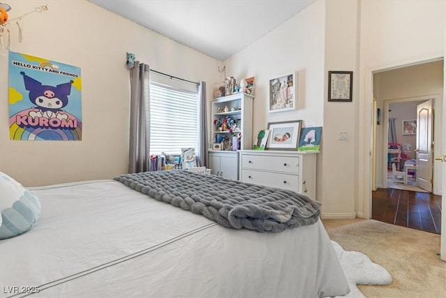 bedroom featuring carpet flooring and baseboards