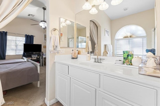 bathroom featuring lofted ceiling, visible vents, a ceiling fan, and vanity