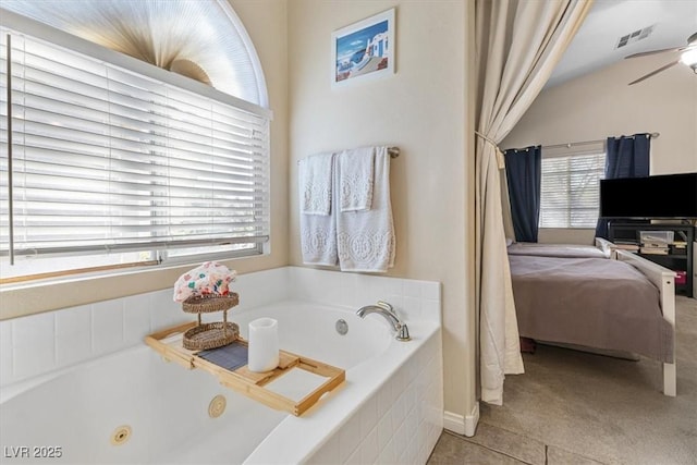 full bath featuring tile patterned flooring, visible vents, a ceiling fan, a tub with jets, and ensuite bath