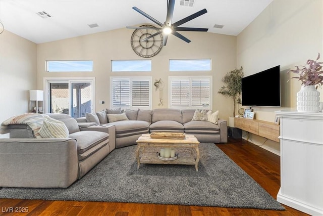 living room with wood finished floors, visible vents, and a ceiling fan