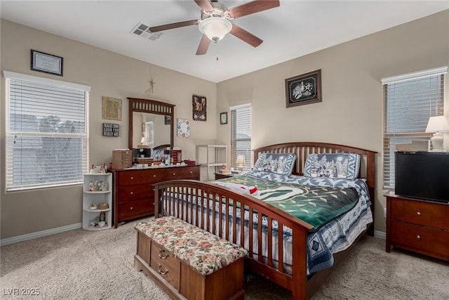 bedroom with a ceiling fan, carpet, visible vents, and baseboards