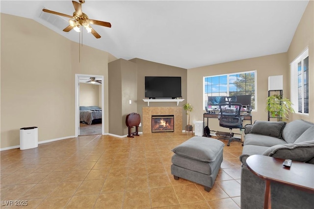 living room featuring lofted ceiling, a fireplace, baseboards, and light tile patterned floors