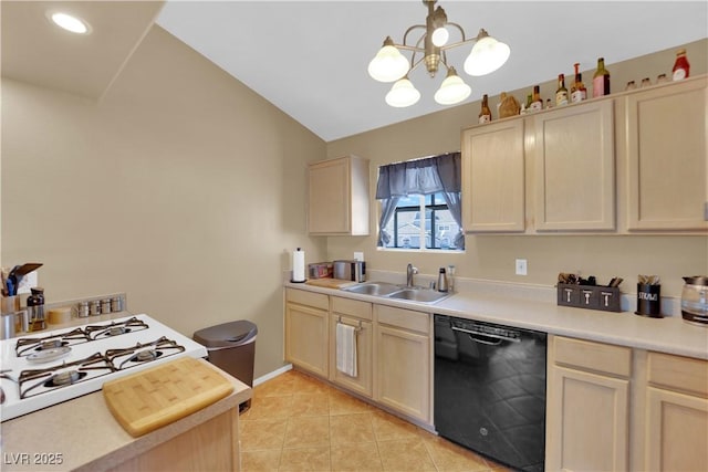 kitchen featuring black dishwasher, a sink, and light brown cabinetry