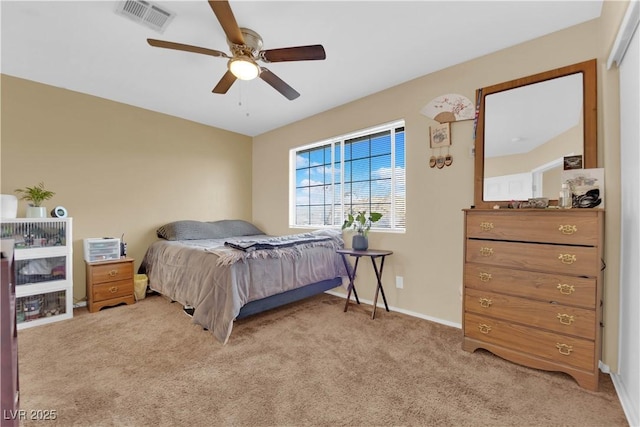 bedroom with ceiling fan, carpet floors, visible vents, and baseboards