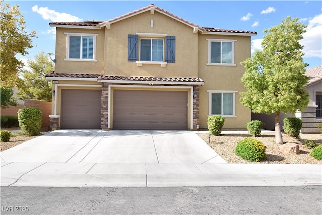 view of front of home with a tile roof, driveway, an attached garage, and stucco siding