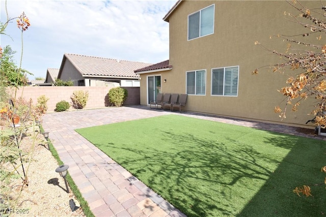 view of yard featuring a patio area and fence