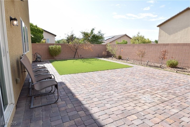 view of patio with a fenced backyard