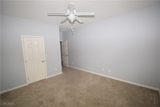unfurnished bedroom with carpet, baseboards, and ceiling fan