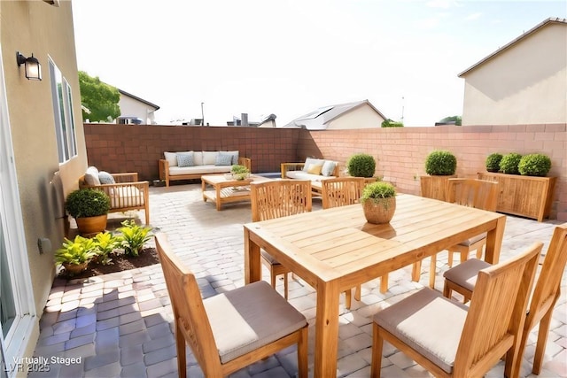 view of patio featuring a fenced backyard and an outdoor hangout area