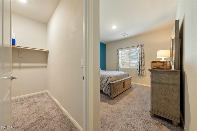 carpeted bedroom featuring visible vents, recessed lighting, and baseboards