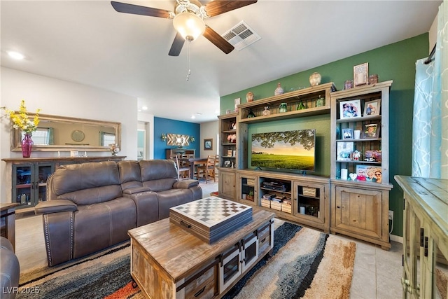 tiled living area featuring visible vents and ceiling fan