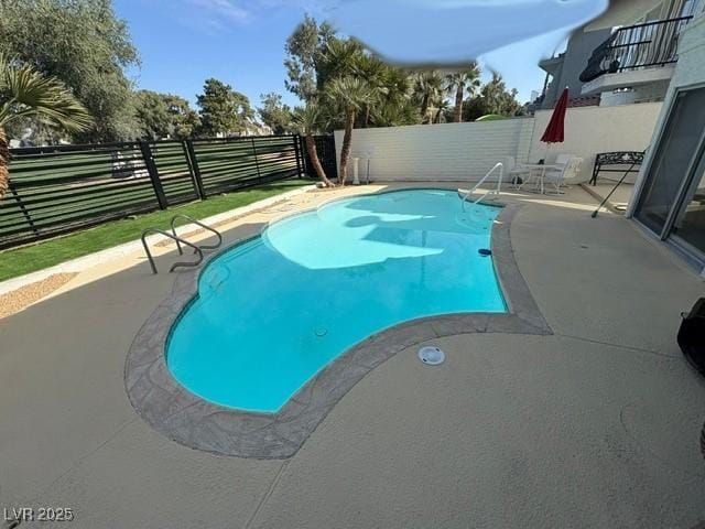 view of pool with a patio area, a fenced backyard, and a fenced in pool