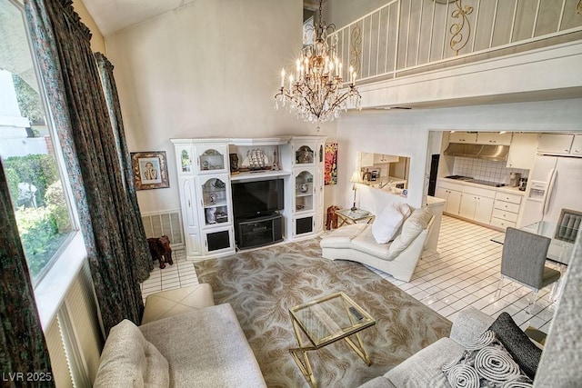 living room with high vaulted ceiling, light tile patterned flooring, and an inviting chandelier