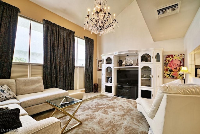 living room featuring visible vents and an inviting chandelier