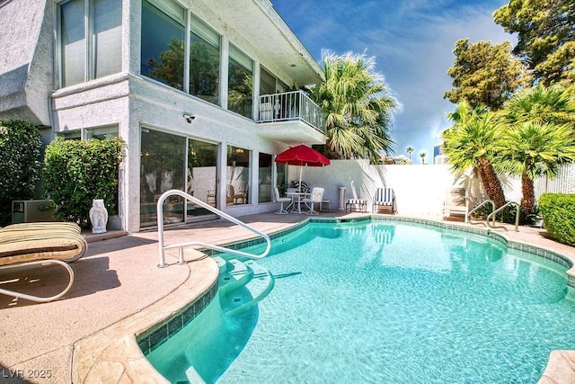 view of pool with a patio, fence, and a fenced in pool