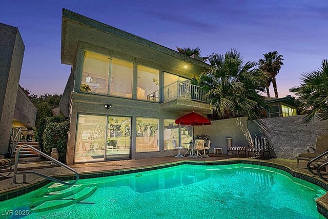 pool featuring a patio area