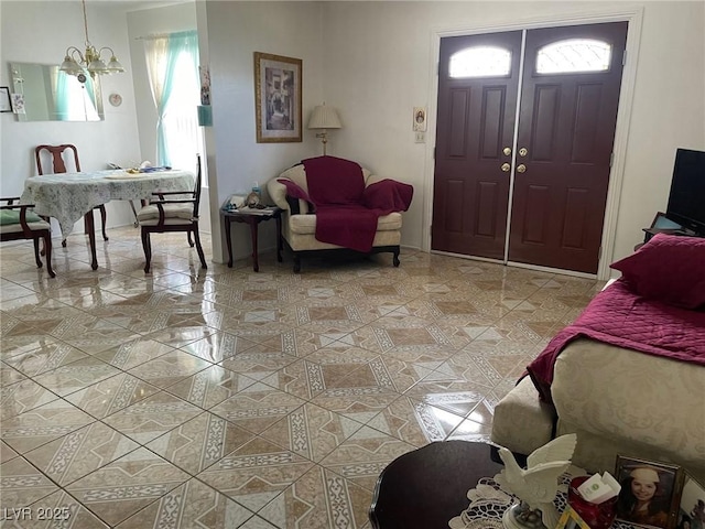 foyer entrance with a chandelier and light tile patterned floors