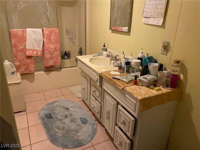 bathroom with shower / bath combination with glass door, tile patterned flooring, and vanity