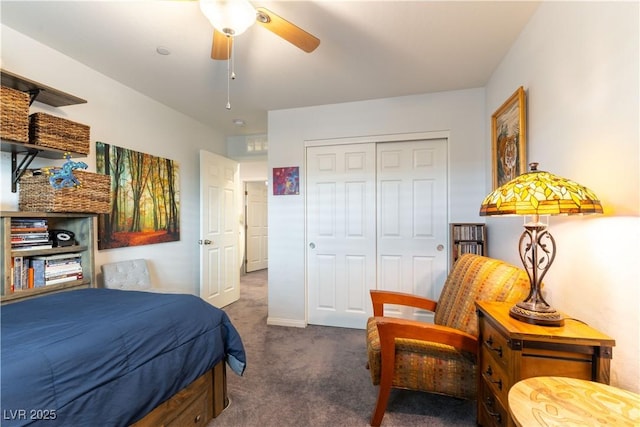 bedroom featuring ceiling fan, a closet, and carpet flooring