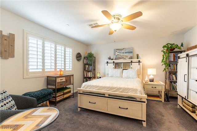 bedroom with ceiling fan, visible vents, and dark carpet