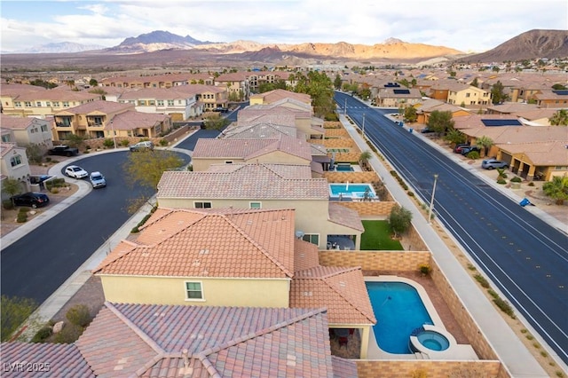 birds eye view of property with a residential view and a mountain view