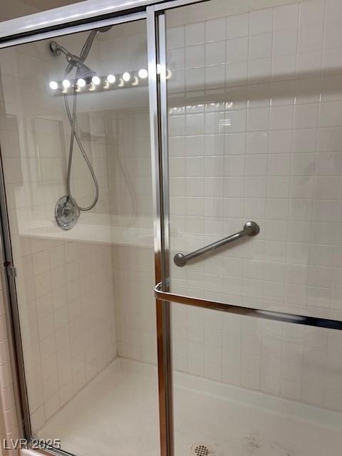 full bath with a shower stall