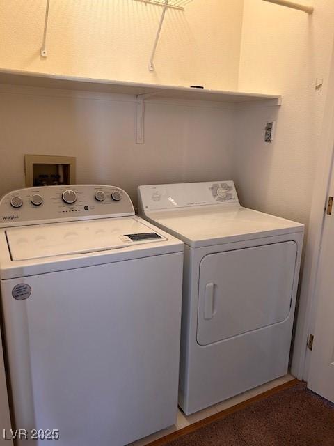 clothes washing area with laundry area and washing machine and clothes dryer