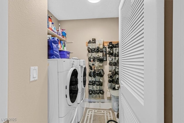 washroom featuring independent washer and dryer, laundry area, and tile patterned flooring