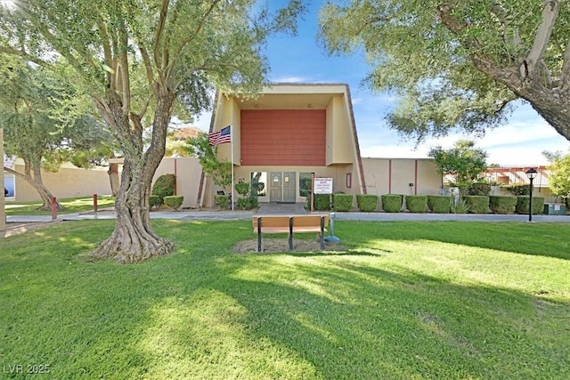 view of home's community featuring a yard