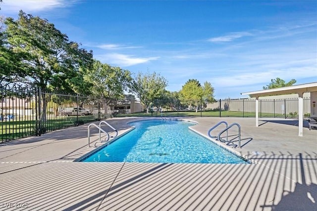 view of pool featuring a patio area, a fenced in pool, and fence