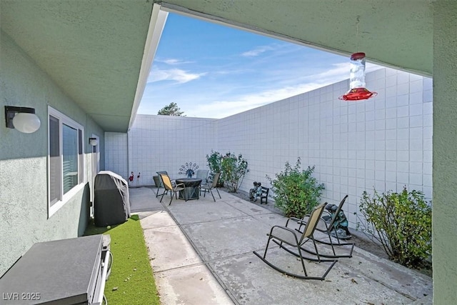 view of patio featuring outdoor dining area