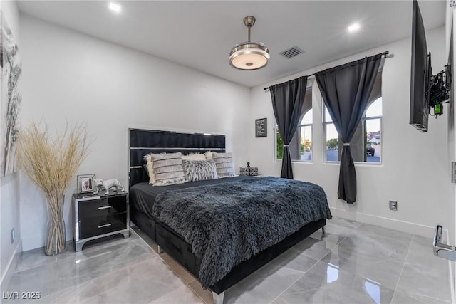 bedroom featuring marble finish floor, baseboards, and visible vents