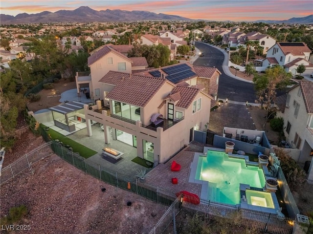 aerial view at dusk with a residential view and a mountain view