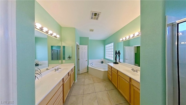 bathroom featuring two vanities, visible vents, and a sink