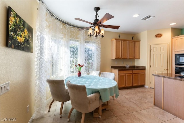 dining space with light tile patterned floors, recessed lighting, visible vents, and a ceiling fan