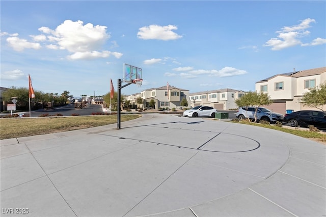 view of basketball court with a residential view and community basketball court