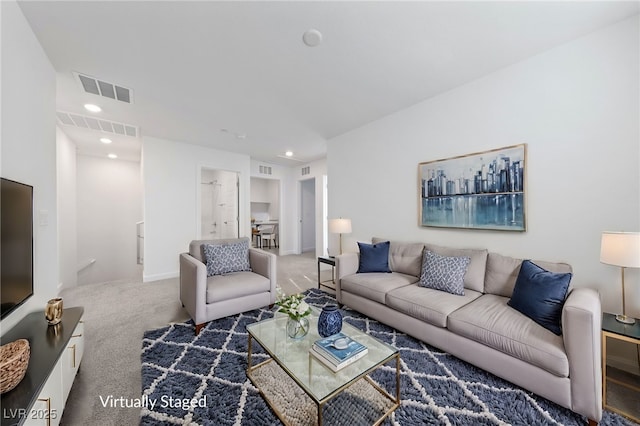 living area with visible vents, carpet flooring, and recessed lighting